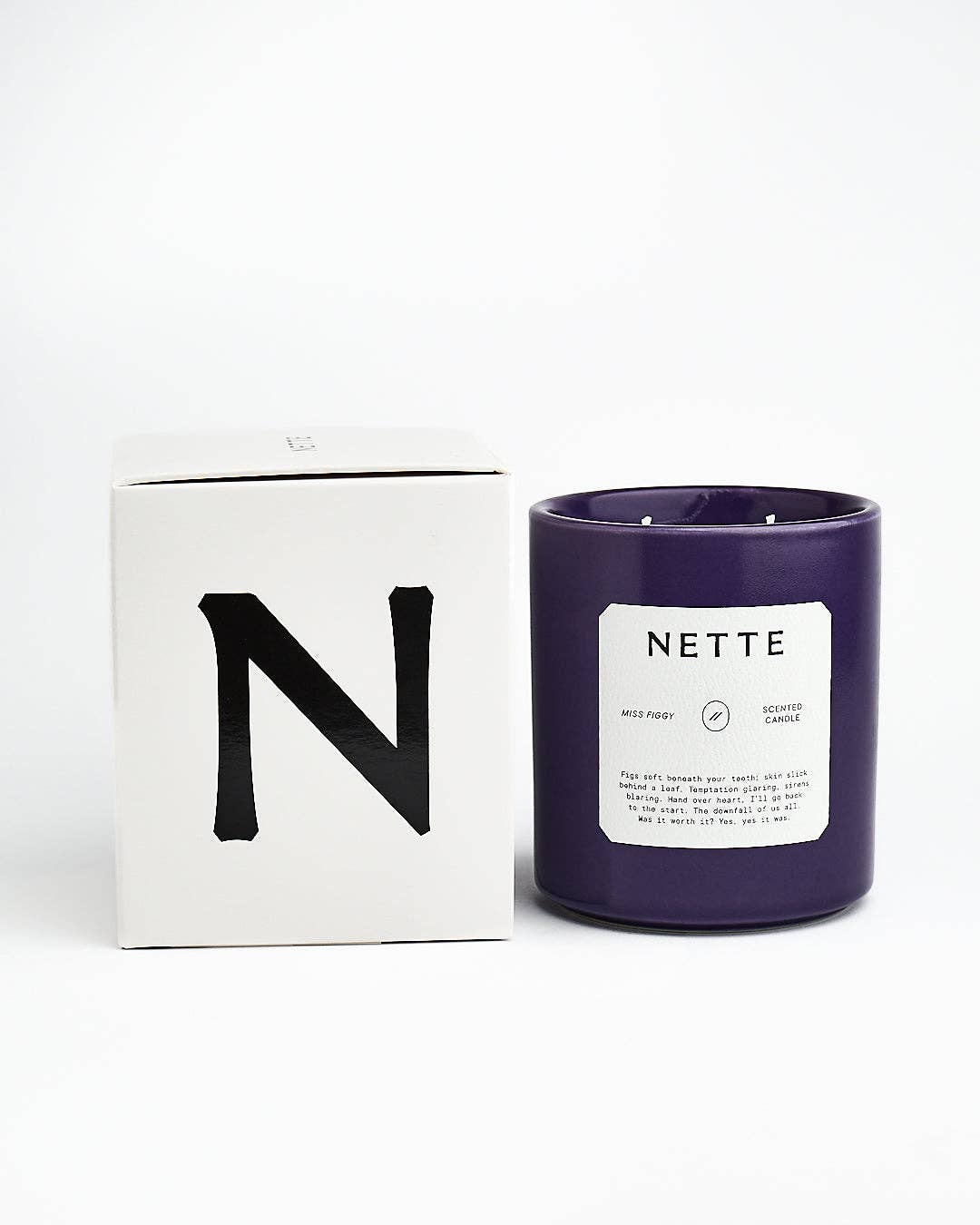 Miss Figgy candle beside its white N box